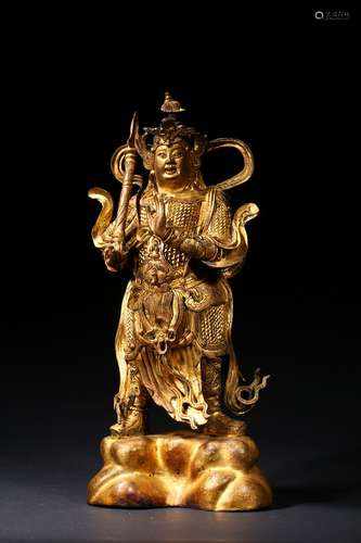 A gilt-lacquered bronze figure of buddhist guardian