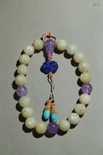 A white jade and amethyst rosary bracelet