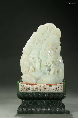 A white jade mountain boulder with spinach stand