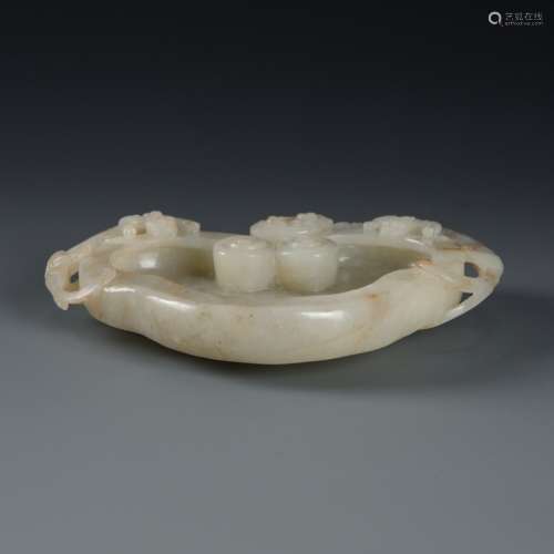 A white jade 'chilong lingzhi' washer