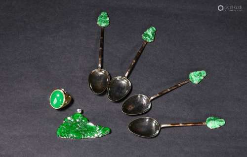 A group of jadeite silver spoons, pendant, and ring