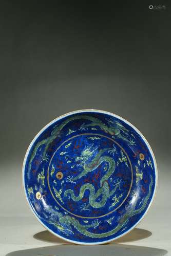 A blue ground yellow and red glaze dragon dish