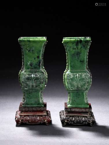 A pair of spinach green jade gu vases