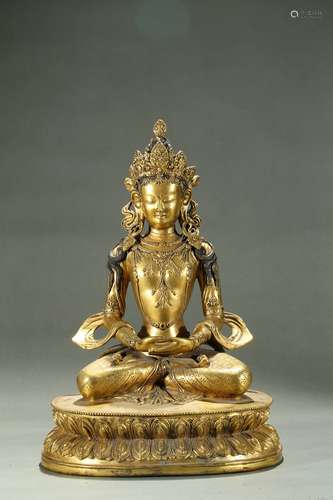 A large gilt bronze figure of amitayus