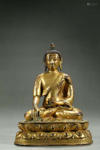 A gilt bronze figure of Shakyamuni with inscription