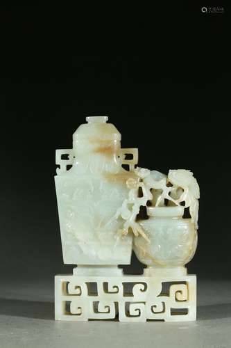 A white jade 'taotie and plum blossom' vase group