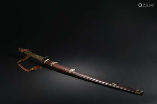 A Japanese katana blade with scabbard