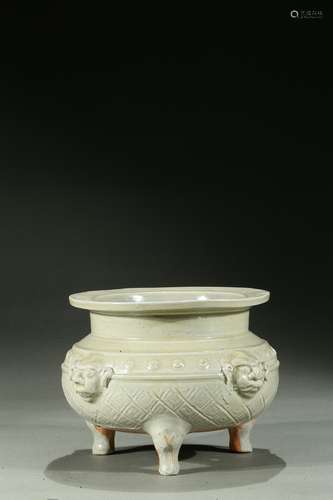 A celadon glazed tripod censer