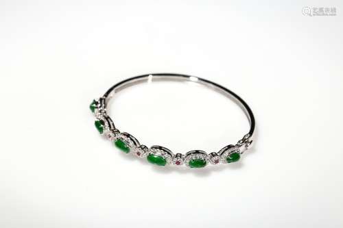 An emerald jadeite diamond bracelet