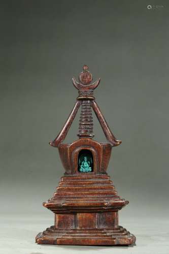 An agarwood stupa with turquoise jambhala