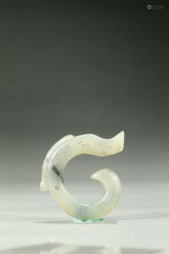 A small archaic jade carved dragon