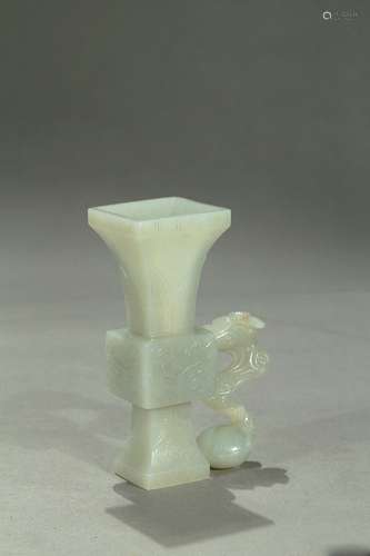 A white jade carved 'taotie' gu vase