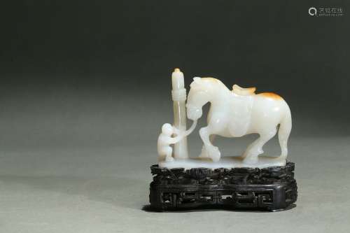 A white jade carving of monkey and horse