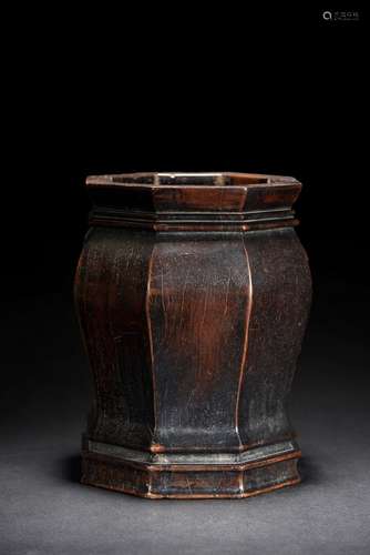 A hexagonal hardwood brushpot