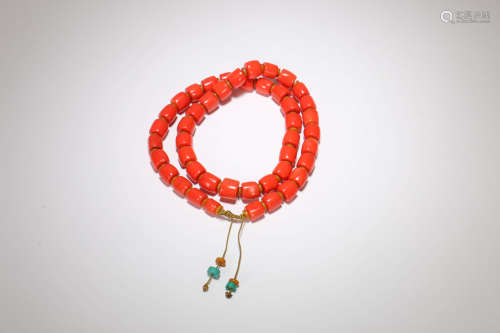 A Chinese Carved Red Coral Beats Necklace