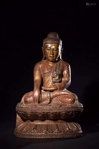 A GILT WOODEN FIGURE OF SHAKYAMUNI