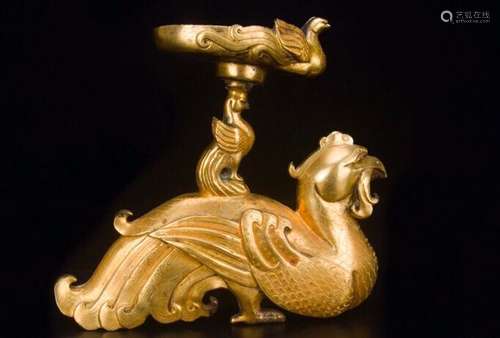 A GILT-BRONZE PHOENIX CANDLE HOLDER