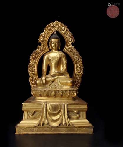 A GILT-BRONZE FIGURE OF SHAKYAMUNI