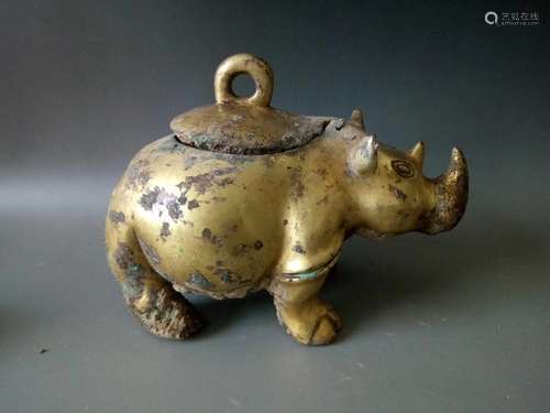 A GILT-BRONZE RHINOCEROS