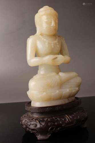 A  HETIAN JADE FIGURE OF BUDDHA AND BASE