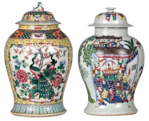 A Chinese famille rose one hundred boys decorated vase and cover with a Kangxi mark; added a ditto yellow ground floral decorated vase and cover, the roundels with phoenix, birds and flower branches, H 41 - 43 cm