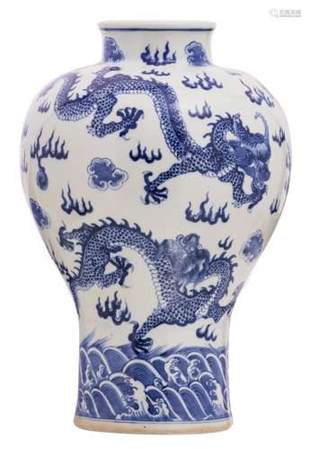 A Chinese blue and white overall decorated Meiping vase with dragons and flaming pearls, with a Qianlong mark, H 46 cm