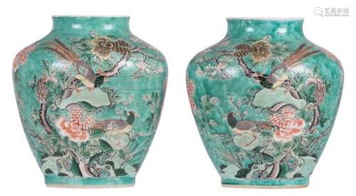 A pair of Chinese turquoise ground famille verte begonia shaped vases, overall decorated with birds and flowers branches, with a Kangxi mark, H 24 cm