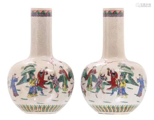 A pair of Chinese famille verte stoneware bottle vases, decorated with the Eight Immortals, H 39 cm