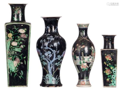 Two Chinese famille noire quadrangular vases and two ditto baluster shaped vases, decorated with flower branches, one vase with an animated scene, one vase Kangxi marked and one vase symbol marked, 19thC, H 29,5 - 47 cm