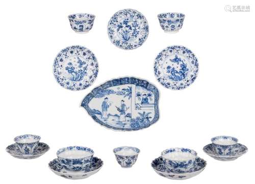 Three sets of Chinese blue and white floral decorated cups and saucers, some marked, Kangxi and period; added a ditto lotus shaped plate, decorated with an animated scene, H 2,5 - 5 - W 20 - D 14,5 - ø 11 - 13 cm