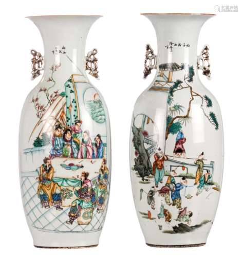 Two Chinese vases, polychrome and famille rose decorated, with an animated scene, playing children and calligraphic texts, H 59 cm