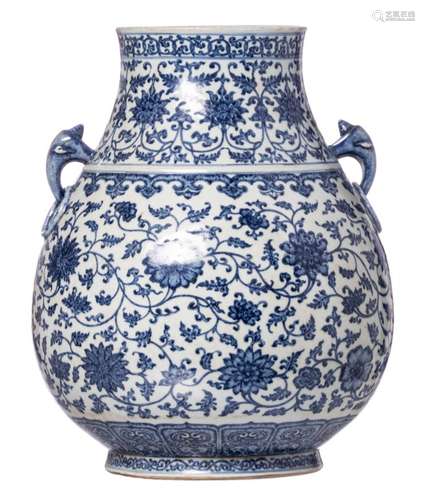 A Chinese blue and white floral and relief decorated Hu vase with a Qianlong mark, 19thC, H 46 cm