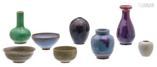 A various Chinese celadon and flambé glazed vases and bowls, some marked; added a Chinese stoneware bottle vase, H 8 - 23 - ø 13 - 18 cm