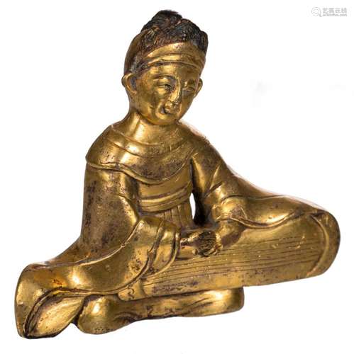 A Chinese gilt bronze figure depicting a qin playing musician, H 7 - W 8 cm