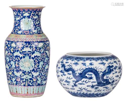 A Chinese blue and white decorated bowl with dragons and a flaming pearl, with a Yongzheng mark; added a Chinese blue ground polychrome and floral decorated vase, H 16,5 - 35 - ø 26 cm