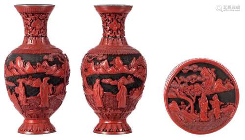 A pair of Chinese red lacquer vases, overall decorated with figures in a landscape, H 22 cm; added a ditto box and cover, H 6 - ø 12,5 cm