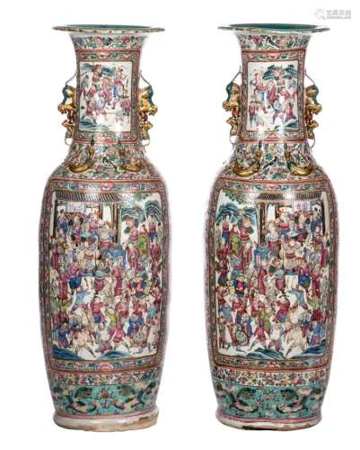 A pair of impressive Chinese famille rose vases, relief decorated with dragons and phoenix, the roundels with court scenes and warriors, 19thC, H 135 cm