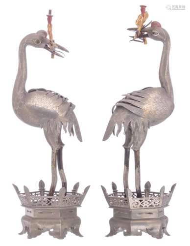 A Chinese pair of polychrome decorated pewter candlesticks, modelled as cranes, marked, H 48 cm