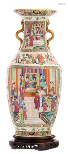 A Chinese Canton famille rose vase, decorated with auspicious symbols and floral motifs, the roundels with court scenes, on a matching wooden stand, H 62 (without stand) - 67 cm (with stand)