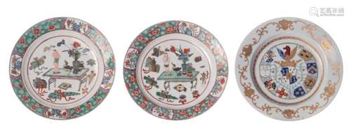 A Chinese polychrome and gilt decorated armorial export porcelain dish, 18thC; added two ditto famille verte floral decorated dishes with antiquities, with a symbol mark, ø 23 cm