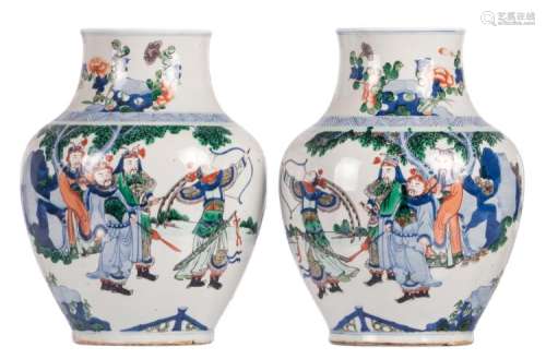 A pair of Chinese wucai vases, overall decorated with warriors, H 31 cm
