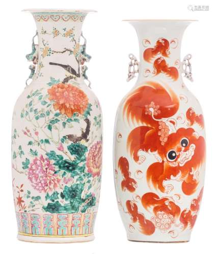 A Chinese famille rose vase, overall decorated with birds and flower branches; added a Chinese iron red vase decorated with Fu lions and calligraphic texts, H 58,5 - 60 cm