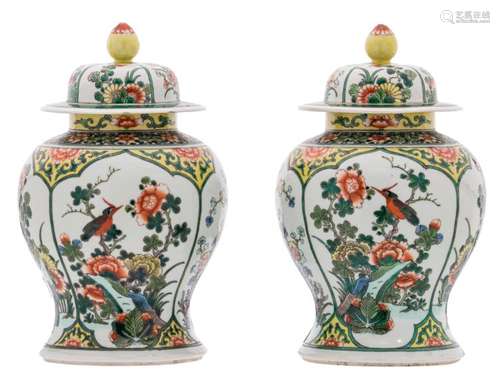 A pair of Chinese famille verte floral decorated vases and covers, the roundels with birds and flower branches, H 35,5 cm