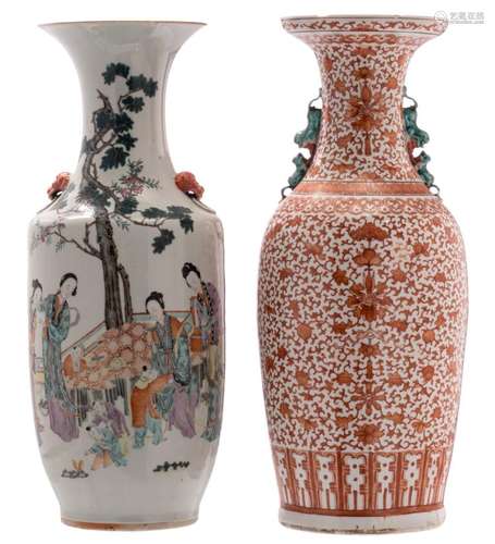 A Chinese iron red floral decorated vase; added a Chinese polychrome decorated vase with a garden scene and calligraphic texts, H 59 - 60 cm