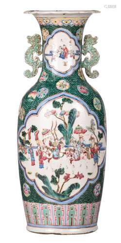 A Chinese green ground famille rose vase, the roundels with animated scenes, the handles dragon shaped, 19thC, H 60,5 cm