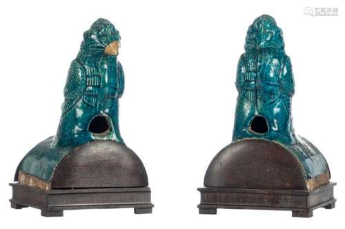 Two Chinese blue glazed bird shaped terracotta roof tiles, Ming, mounted on a wooden stand, H 22 cm (without base) - 26 cm (with base)