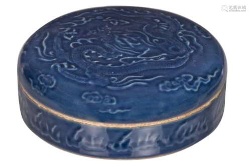 A Chinese blue monochrome glazed box and cover with low relief dragon decoration, H 7,5 cm - ø 22 cm