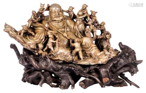 An exceptional Chinese Qing dynasty soapstone group of a Budai, surrounded by playing children, Fu lions and a rat, H 35 (without base) - 49 (with base) - W 75 - D 45 cm