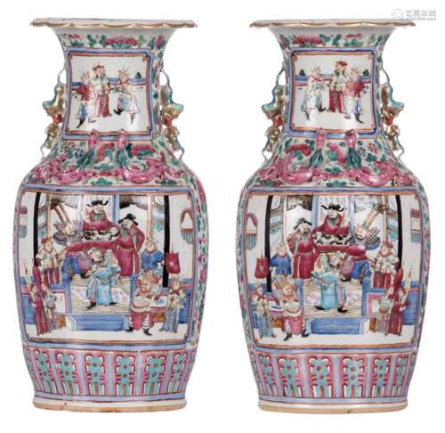 A pair of Chinese famille rose vases, decorated with a court and a warrior scene, 19thC, H 46 cm