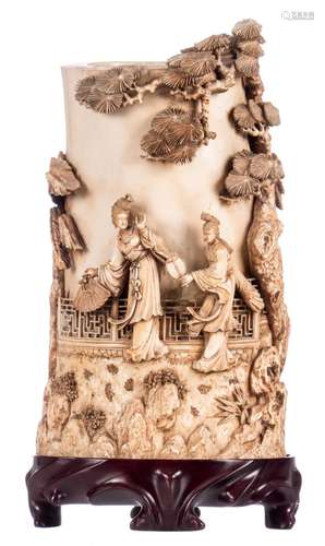 A Chinese carved and openwork ivory vase, depicting a gallant garden scene on a matching wooden base, first half of the 20thC, H 25,5 (without base) - 29,5 cm (with base) - Weight: about 1840 g